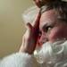 Ann Arbor Santa Claus Danny Maier looks in a mirror to adjust his beard and facial makeup on Sunday. Daniel Brenner I AnnArbor.com